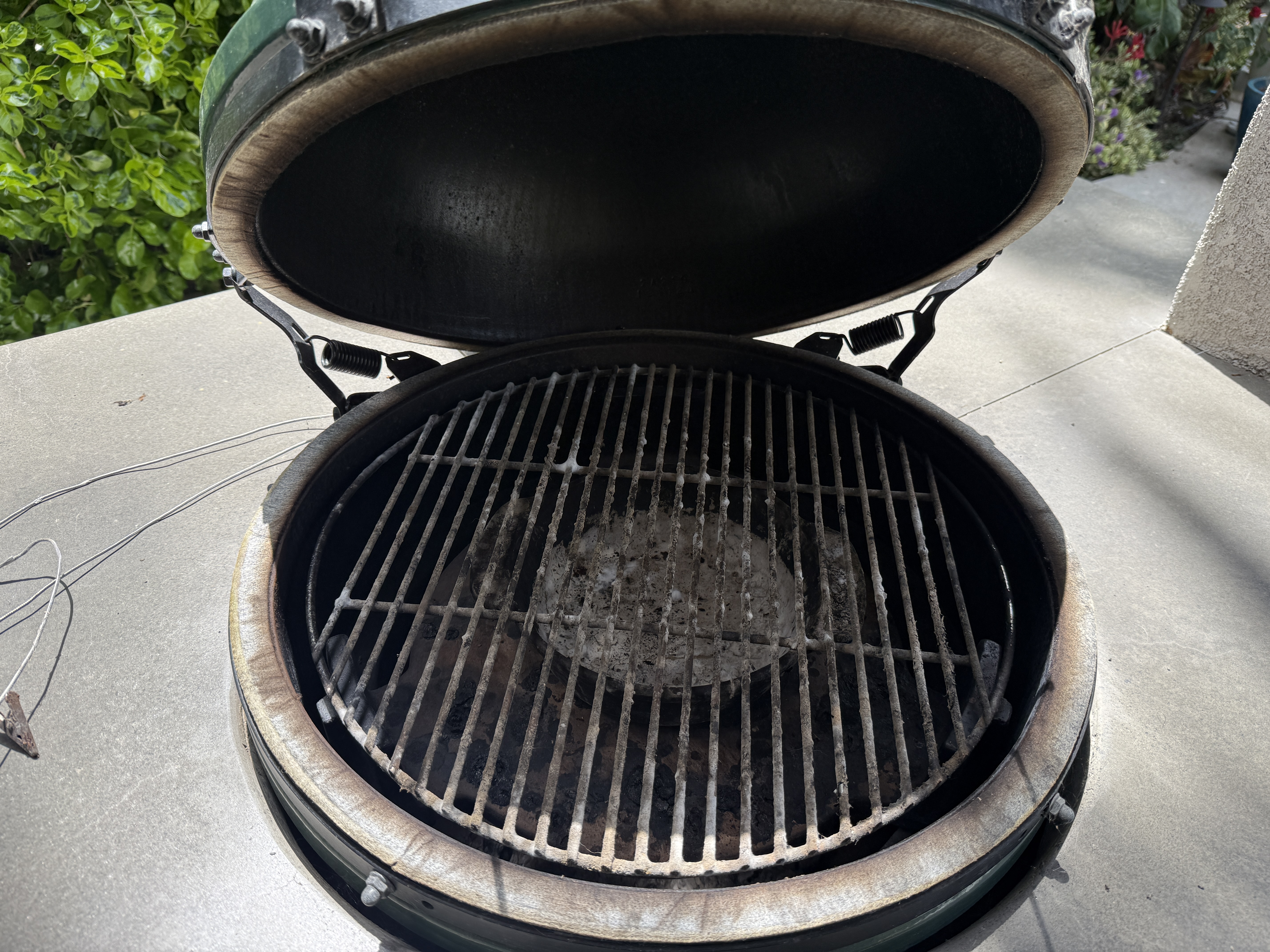 Kamado grill with carbon buildup before professional cleaning